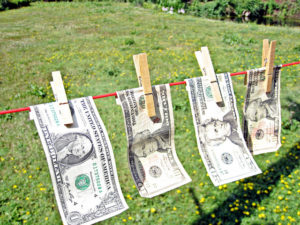 Image: US currency on a clothesline