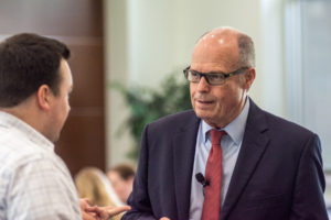 Image: Richard M. Bowen talking with a conference participant.
