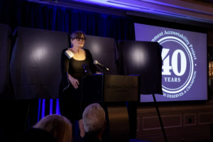 Image: Kristina Borjesson speaking at podium during GAP celebration