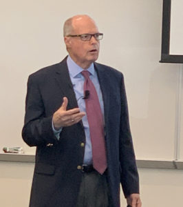 Picture of Richard M. Bowen speaking at a conference.