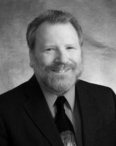 "William K. Black" by Kristen Hellstrom - otrs:2009060210050291. Licensed under CC BY-SA 3.0 via Wikimedia Commons
